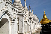 Myanmar - Mandalay, Sandamuni Pagoda. The entire ground is covered with 1749 small white pagodas with stone slabs with the Buddhist Tripitaka. 